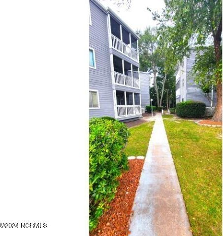 10166 Beach Dr SW Unit 5306, Calabash, NC 28467 - surrounding community with a lawn