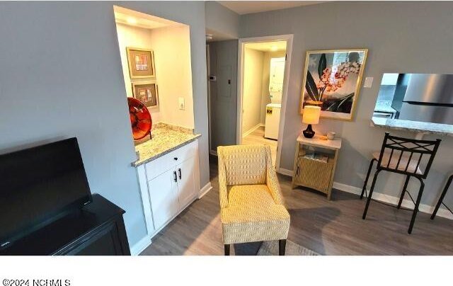 10166 Beach Dr SW Unit 5306, Calabash, NC 28467 - living area with wood finished floors and baseboards