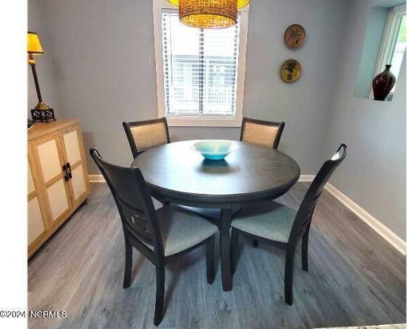 10166 Beach Dr SW Unit 5306, Calabash, NC 28467 - dining space with baseboards and light wood-style flooring