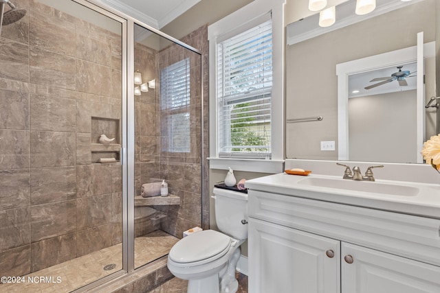 bathroom featuring toilet, an enclosed shower, vanity, ceiling fan, and crown molding