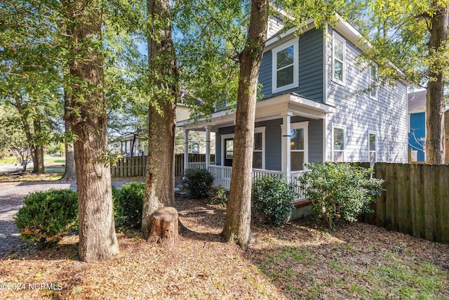 view of side of property featuring a porch