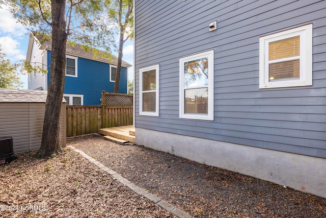 view of home's exterior with a wooden deck