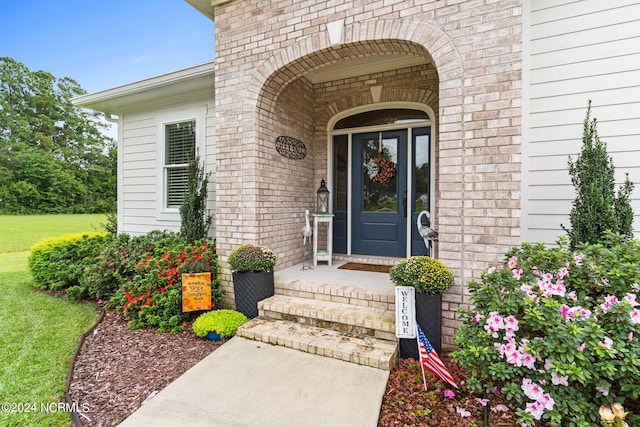 property entrance featuring covered porch