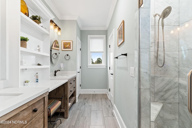 bathroom with crown molding, vanity, and an enclosed shower