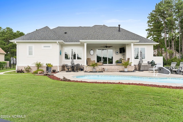 rear view of property with a lawn, ceiling fan, and a patio area