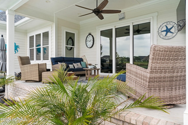 view of patio with an outdoor living space and ceiling fan