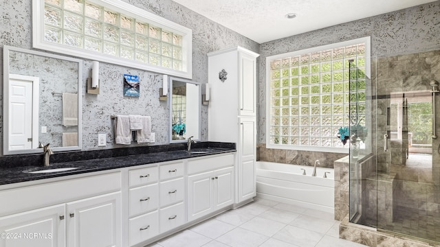 bathroom featuring tile patterned flooring, plenty of natural light, vanity, and separate shower and tub