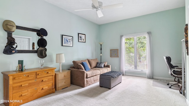 interior space with ceiling fan