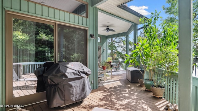 wooden terrace with a grill and ceiling fan