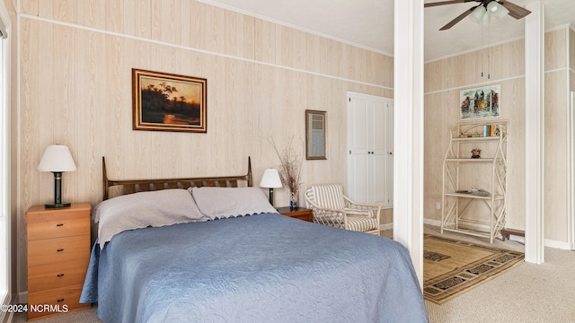 bedroom featuring ornamental molding, carpet, and ceiling fan