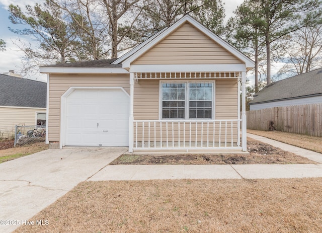 view of front of home featuring a garage and a porch