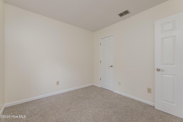 empty room featuring carpet flooring