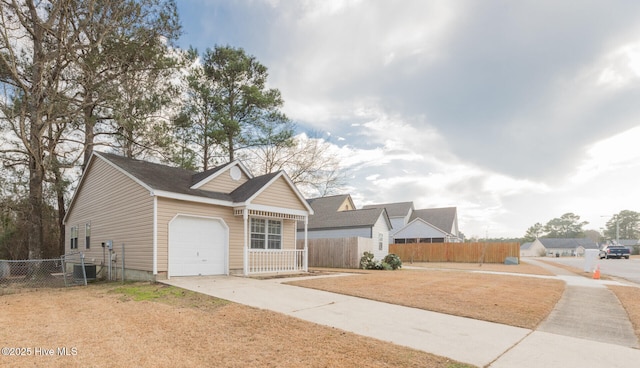 view of front of house with a garage and a front lawn