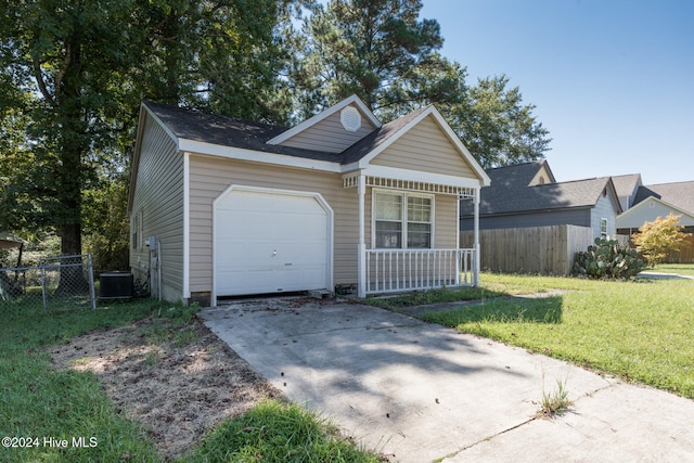 view of front facade with a porch, a garage, central AC, and a front lawn