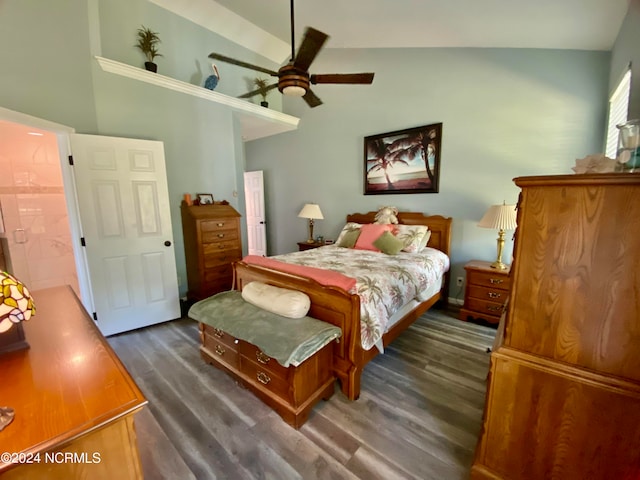 bedroom featuring vaulted ceiling, ceiling fan, ensuite bathroom, and dark hardwood / wood-style flooring