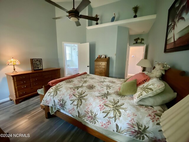 bedroom with ceiling fan, dark hardwood / wood-style floors, and ensuite bathroom