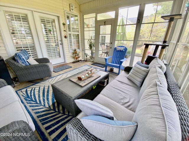 sunroom with vaulted ceiling