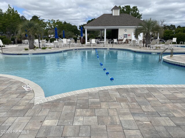 view of patio / terrace featuring a community pool