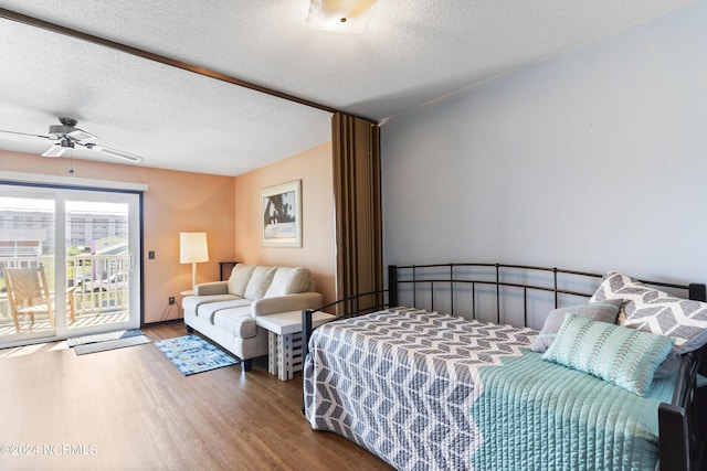 bedroom featuring hardwood / wood-style flooring, ceiling fan, access to exterior, and a textured ceiling