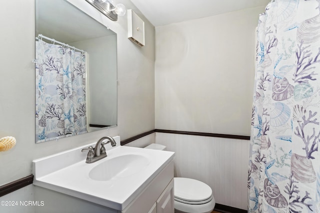 200 Lake Park Blvd S Unit 7A, Carolina Beach, NC 28428 - bathroom with vanity, wainscoting, and a shower with curtain