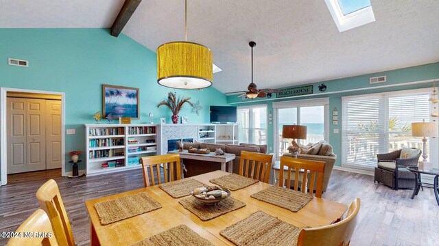 interior space featuring hardwood / wood-style floors, lofted ceiling, and a fireplace