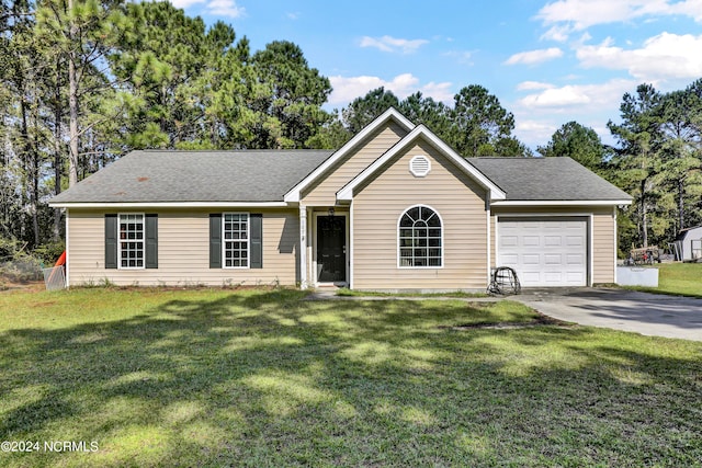 ranch-style home featuring a front lawn and a garage