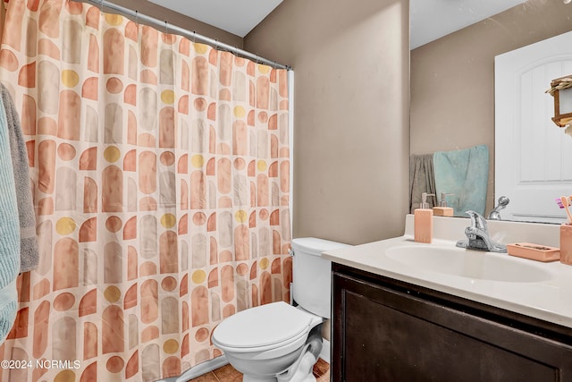 bathroom featuring walk in shower, vanity, and toilet