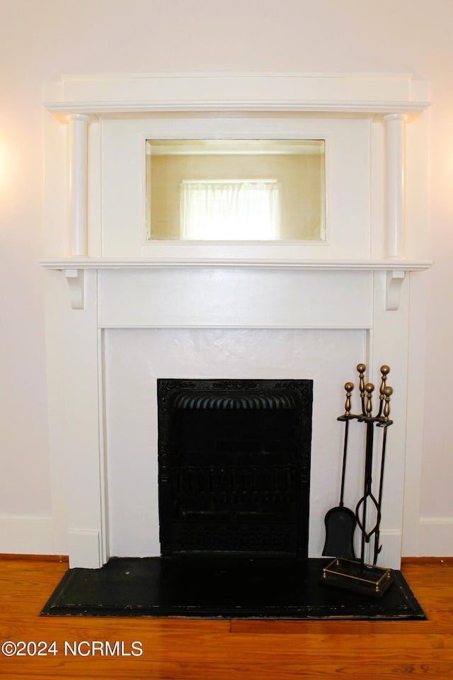 interior details featuring hardwood / wood-style flooring