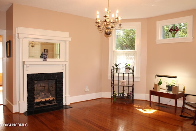 living room featuring a chandelier and hardwood / wood-style flooring