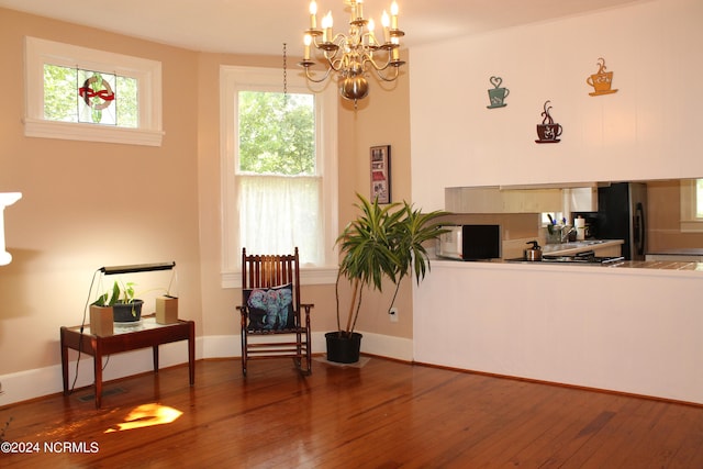 interior space featuring an inviting chandelier and hardwood / wood-style floors