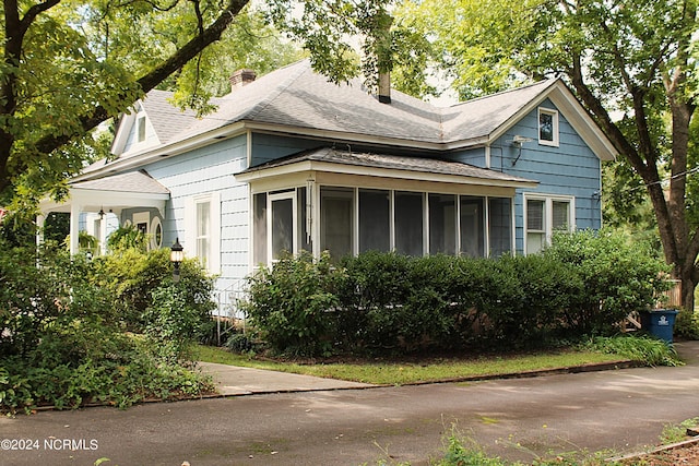 view of front facade featuring a sunroom