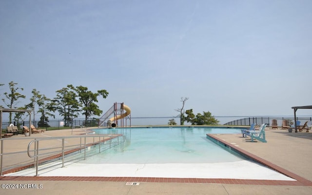 view of pool featuring a water slide