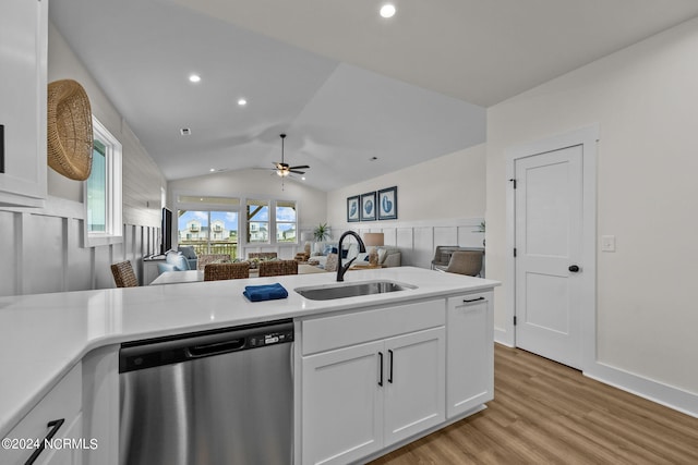 kitchen with white cabinets, lofted ceiling, ceiling fan, stainless steel dishwasher, and sink