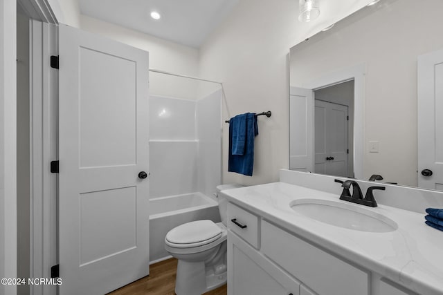 full bathroom featuring wood-type flooring, vanity, toilet, and shower / bathtub combination