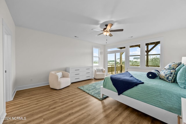 bedroom with ceiling fan and hardwood / wood-style flooring