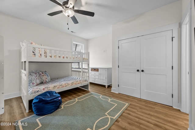 unfurnished bedroom featuring a closet, ceiling fan, and hardwood / wood-style floors