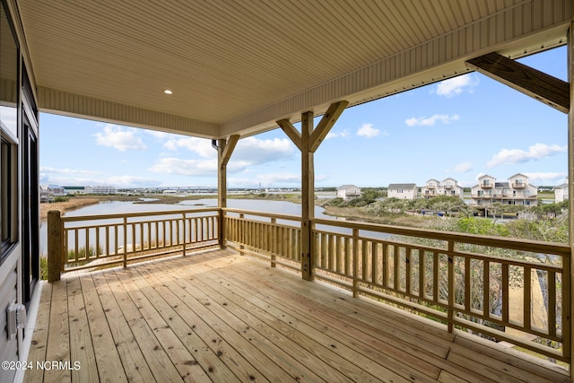 wooden deck with a water view