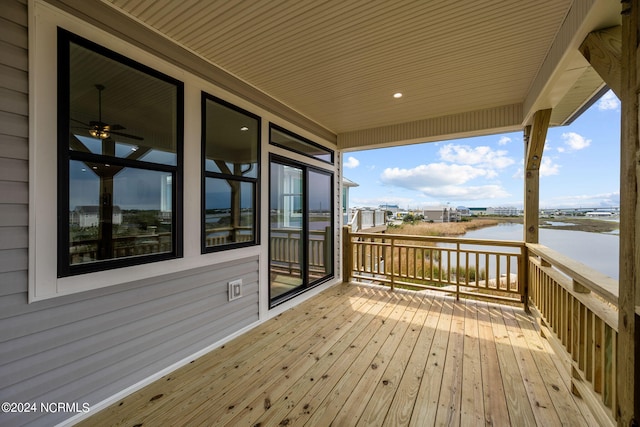 wooden deck with a water view