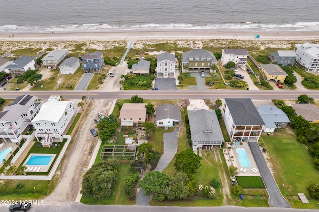 aerial view featuring a water view and a beach view