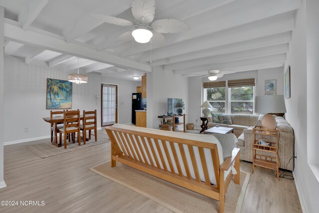 living room with light hardwood / wood-style flooring, beamed ceiling, and ceiling fan