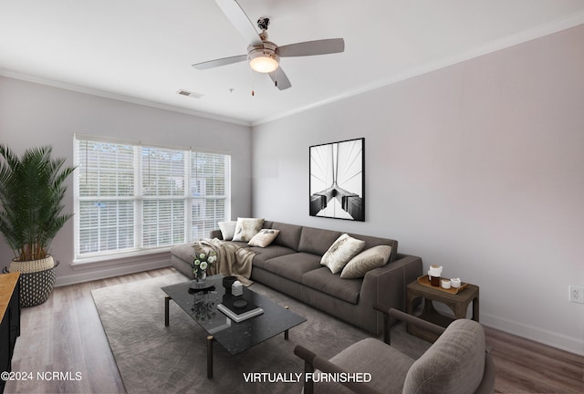 living room with crown molding, hardwood / wood-style floors, and ceiling fan