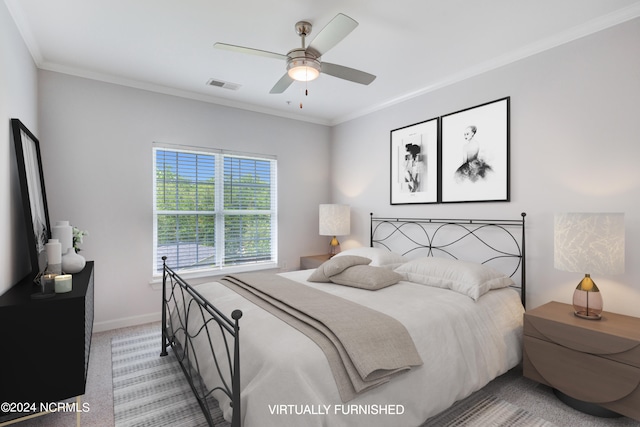 bedroom featuring ceiling fan, light colored carpet, and crown molding