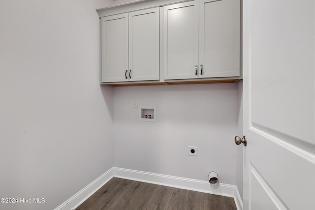 clothes washing area featuring hookup for a washing machine, dark hardwood / wood-style flooring, cabinets, and hookup for an electric dryer