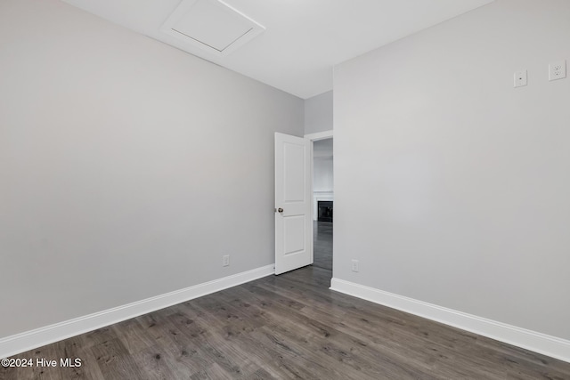 spare room featuring dark hardwood / wood-style flooring