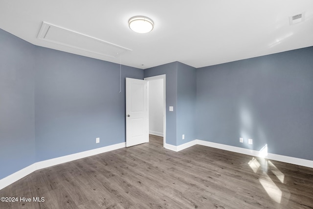 empty room featuring hardwood / wood-style flooring