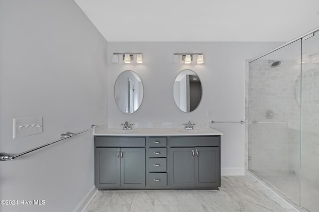 bathroom featuring vanity and a shower with shower door