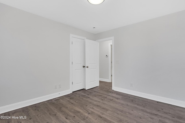 empty room featuring dark wood-type flooring