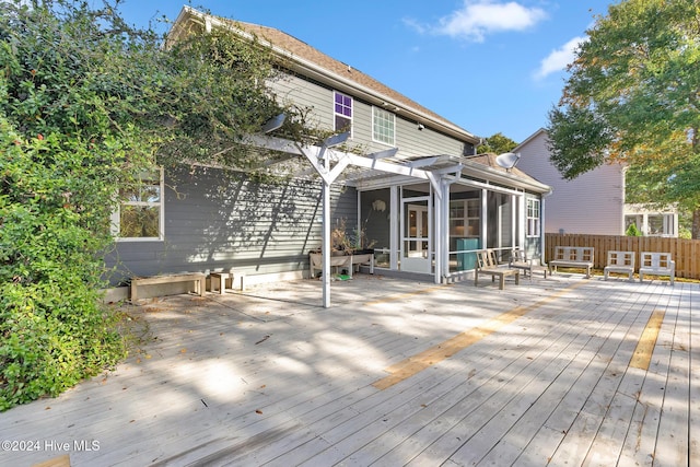 deck with a sunroom