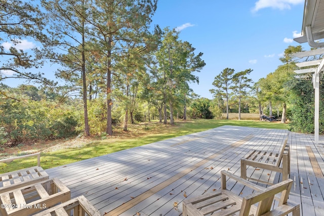 wooden terrace featuring a lawn