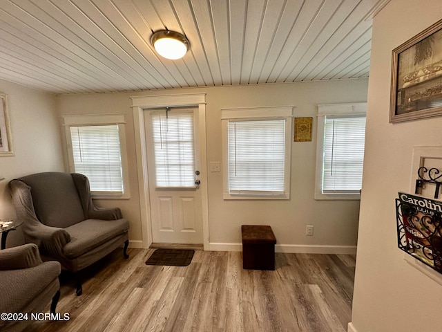 foyer featuring wood ceiling and hardwood / wood-style floors